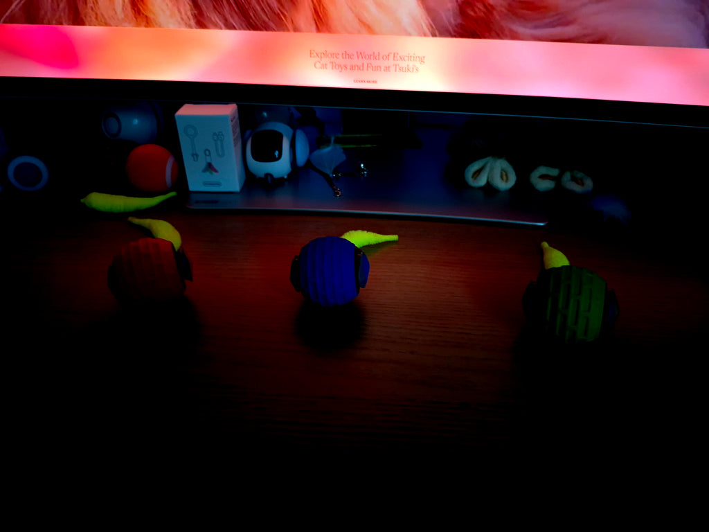 Toy car with colorful lights on a wooden surface
